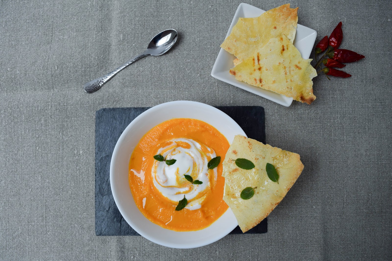Cream of Carrot Soup Served with Bread Roll