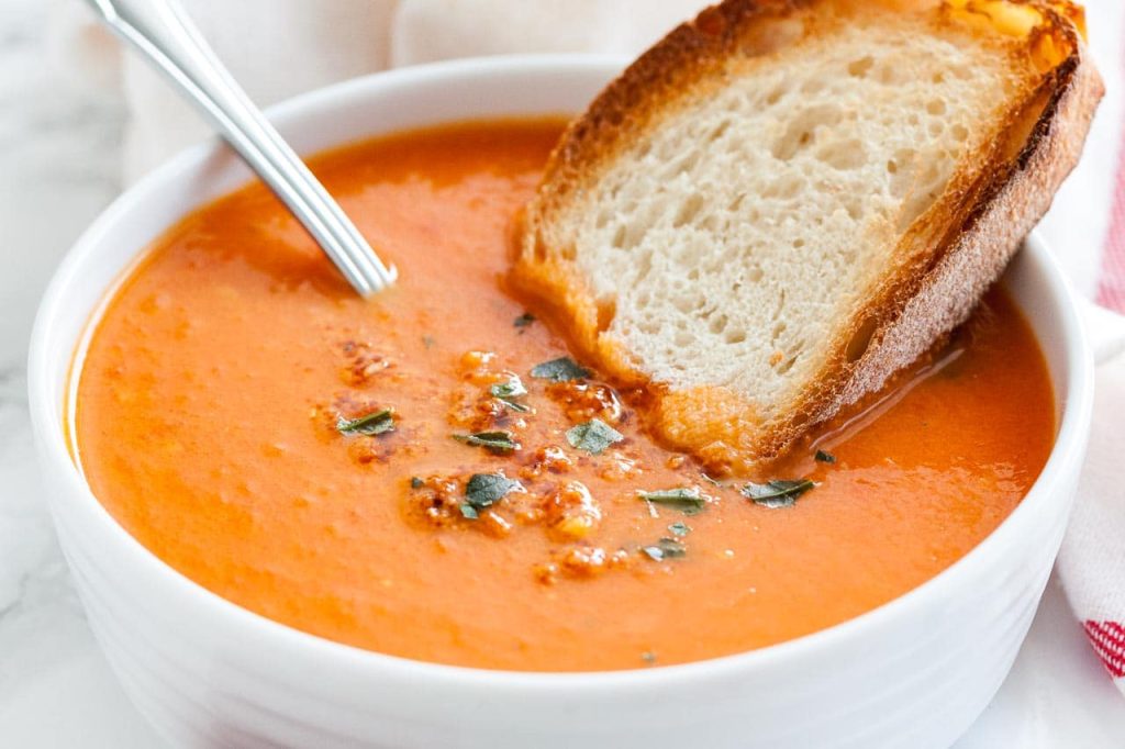 Tomatoes Soup Served with Bread Roll